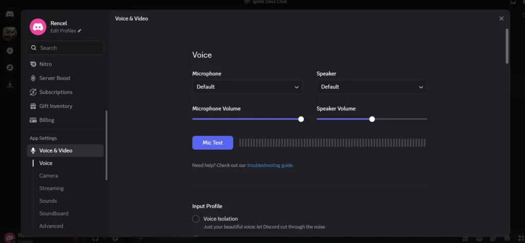 In Discord, open User Settings, go to Voice and Video, and choose your preferred microphone as the input device