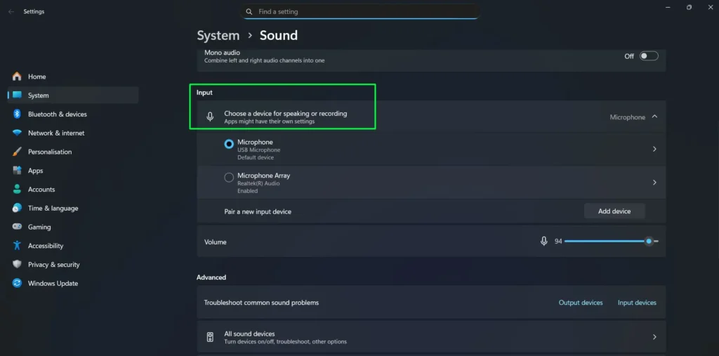 Scroll down to the Input section where you'll find 'Choose a device for speaking or recording' and Click on your preferred input device