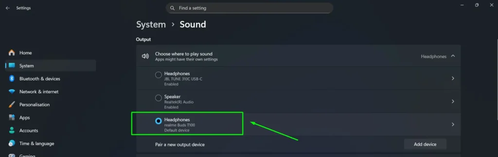 Under Output, find your Bluetooth earbuds listed as the default device and click the arrow on the right to open its properties