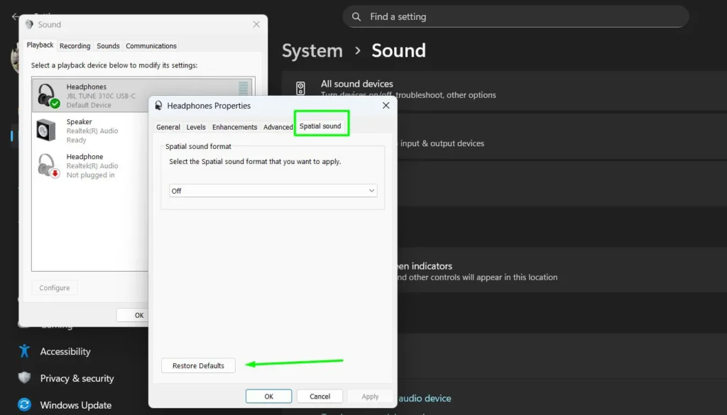 Click the Spatial Sound tab and click Restore Defaults