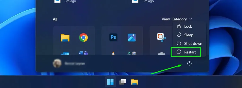 Click the Start button, select the Power icon, then choose Restart
