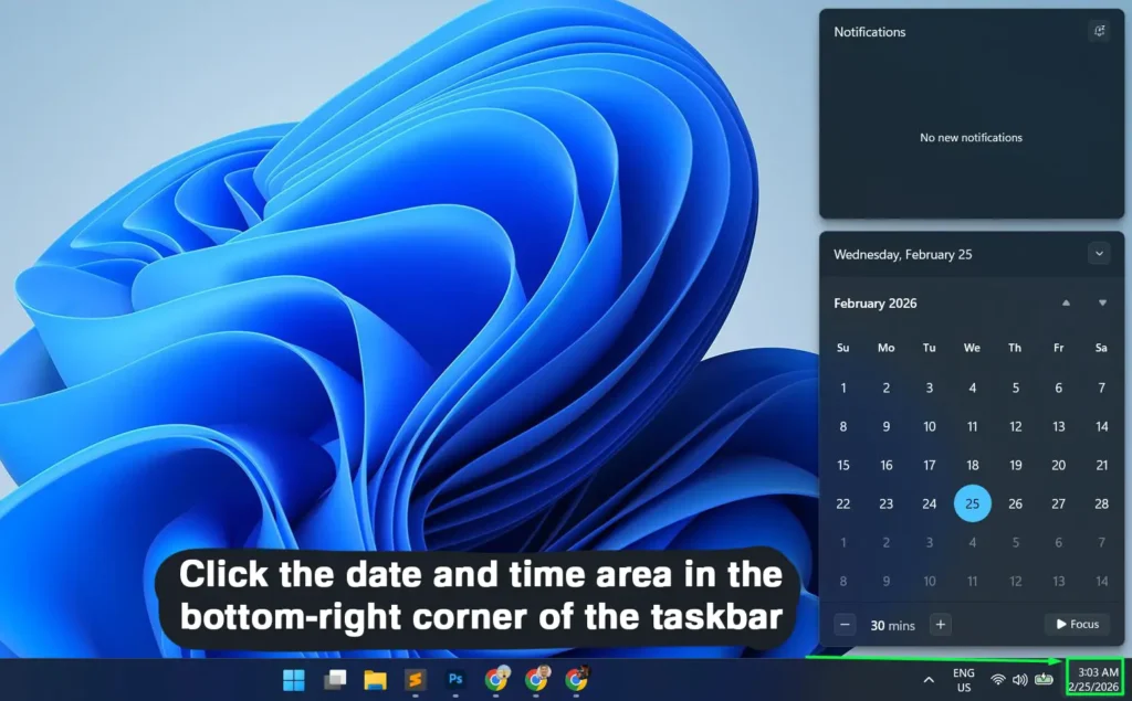 Click the date and time area in the bottom-right corner of the taskbar