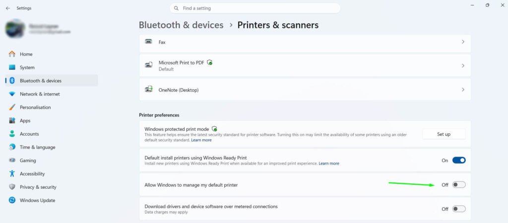 Scroll down to Printer preferences and toggle off 'Allow Windows to manage my default printer'